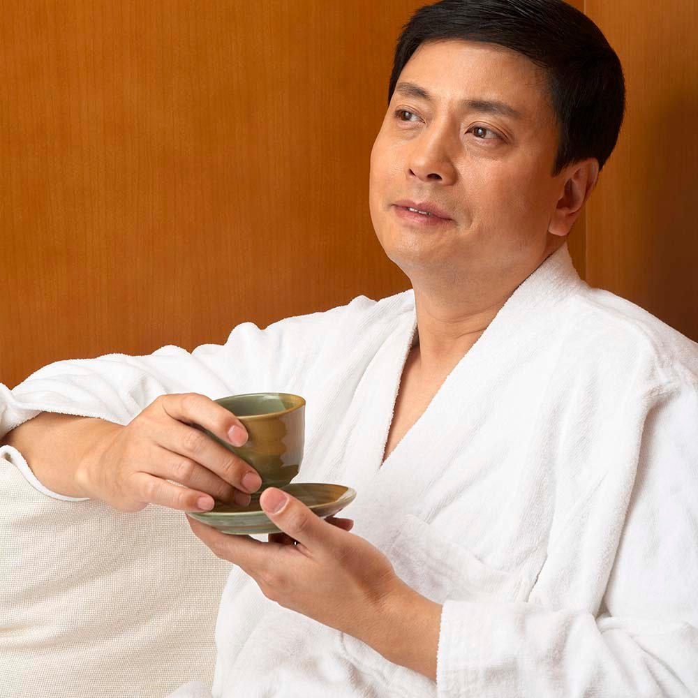 man drinking tea at a spa p2bl4dj.jpg
